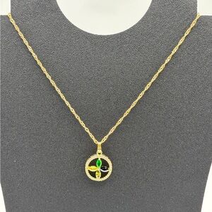 Gold Pendant Necklace with Green and Black Accents